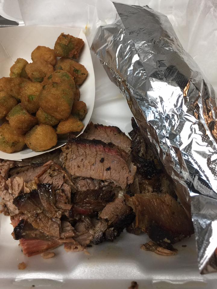 Delicious barbecue brisket, fried okra, and a large baked potatoe.