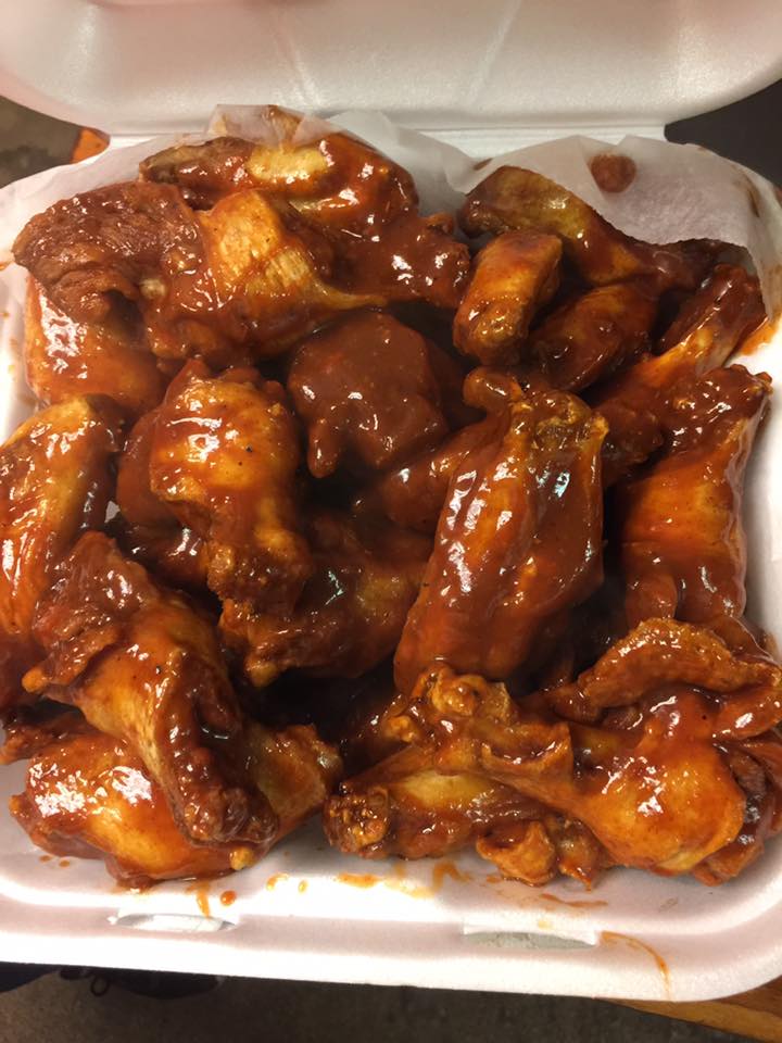 A heap of barbecue glazed chicken wings.